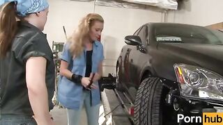 A redhead lesbian has sex with her girlfriend in a garage setting