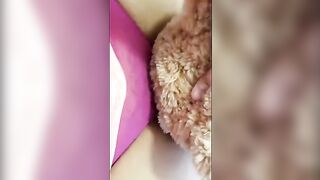 A girl is fucking with her teddy bear passionately