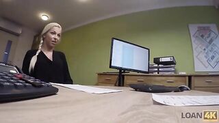The woman is trying to get a loan from the businessman in the office for business