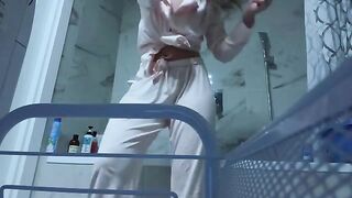 A girl caresses her pussy in the bathroom, feeling herself without inhibition