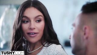 A gorgeous brunette woman, April, experiences intense anal sensations in a high-quality video