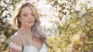 A glamorous woman has an intimate moment with nature on her terrace