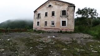 An exhibitionist girl walks through abandoned buildings in HD