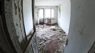 An exhibitionist girl walks through abandoned buildings in HD