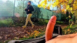 A guy masturbates publicly in the park, a hot MILF notices and joins in