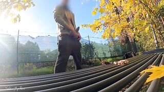 A guy masturbates publicly in the park, a hot MILF notices and joins in