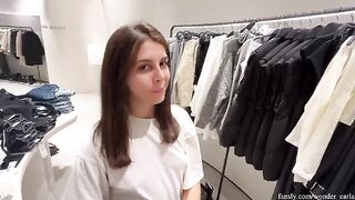 A girl cheats on her boyfriend in the fitting room of a shopping mall