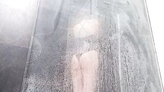 A woman with a wet pussy squirts in the shower