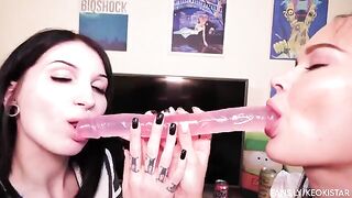 Two lesbian beauties play with their sweet pussies using a dildo