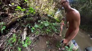 A couple engaged in passionate sex on the jungle river