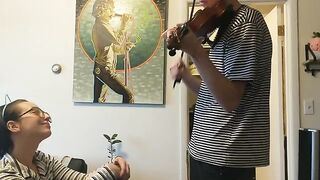 A couple has passionate sex while the girl practices her violin, showcasing real intimacy