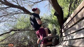Busty girl almost caught giving a blowjob by the lake in this risky scene