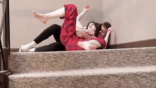 A stepsister is teasing her stepbrother, leading to sex on the stairs
