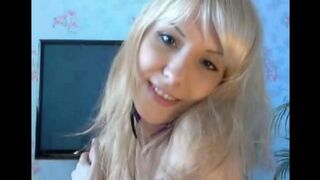 The pretty blonde touches herself, caressing her pussy with her fingers