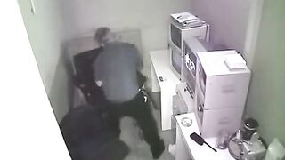 The camera captured the intimate moment in the workplace without notice