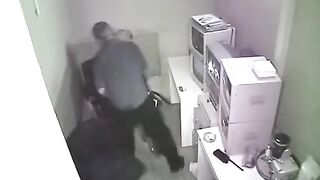 The camera captured the intimate moment in the workplace without notice