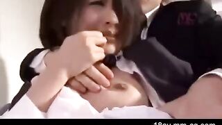 Asian guy is painting the wall when his sister comes