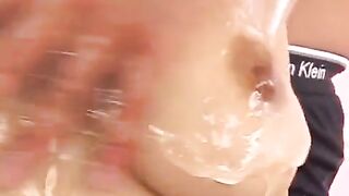 Hot Japanese girl rubs her boobs with oil and fingerbangs