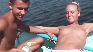 Sexy girls are having fun on the river with a young man
