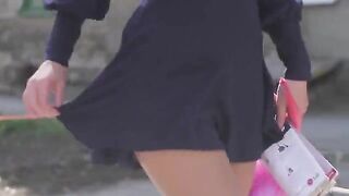 A very beautiful girl shows her body by undressing slowly