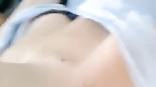 A half-naked girl tells a lie and caresses her body with her hands in a sensual way
