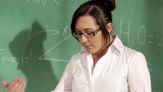 The girl is having fun with her lesbian teacher on the table