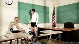 The girl is having fun with her lesbian teacher on the table
