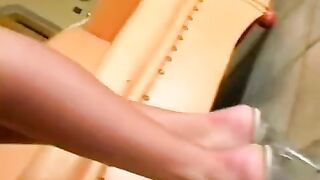 A nice girl caresses herself with a leather chair, getting even more pleasure