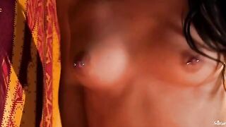 A girl with a nipple piercing plays with her fingers in the pussy