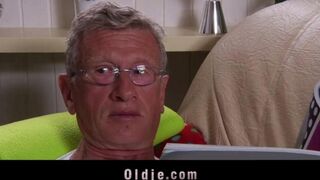 A hot woman is fucking with an old man on the couch