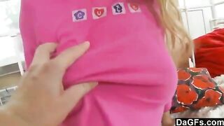 A sweet young blonde plays with her panties and a toy