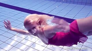 Helen took a swim in the pool without swimming suits