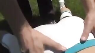 A beautiful busty brunette woman receives a cumshot on her boobs