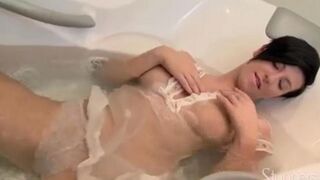 Brunette takes shower and masturbates with soap suds
