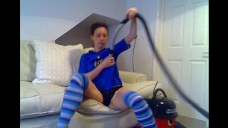 A cute girl brought a new vacuum cleaner and played with it