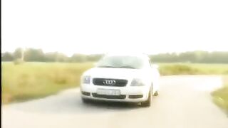 A blonde has sex on the hood of a car with her shaved pussy