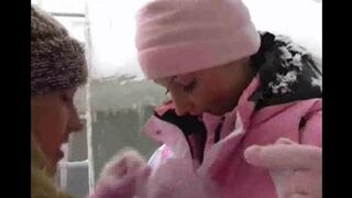 Two girls are having fun on a cold winter day, bringing some heat