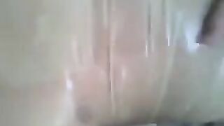 A guy put a condom on his dick and then masturbated it