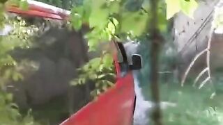 The guy squeezed tits of a girl by a car and began to fuck her