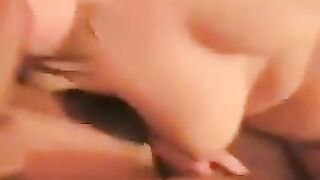 A woman with a big ass spreads her legs to show her nude charms