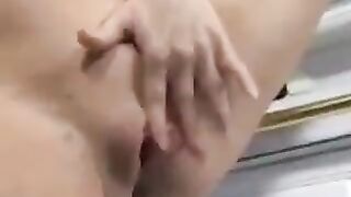 A man came to the kitchen and saw a pregnant woman with her legs spread