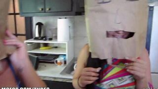 The girls wear bags on their heads during the party