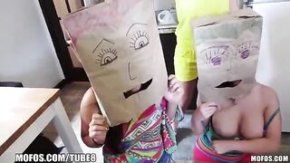 The girls wear bags on their heads during the party