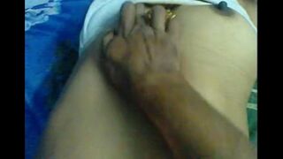 The husband massages the nipples of his wife in a steamy homemade scene