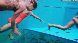 Nude beauties playing in the pool without any clothes