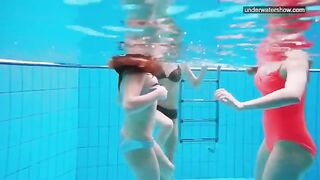 Nude beauties playing in the pool without any clothes