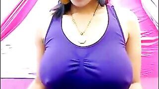 Her nipples are standing through a T-shirt because she's too excited