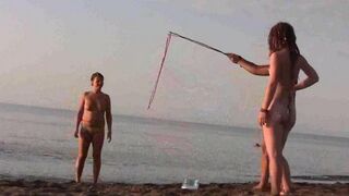 A young girl is fucking on the public beach without any clothes
