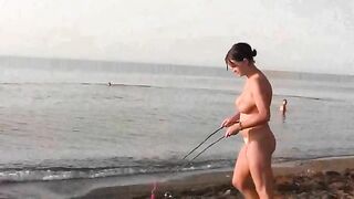 A young girl is fucking on the public beach without any clothes