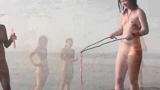 A young girl is fucking on the public beach without any clothes